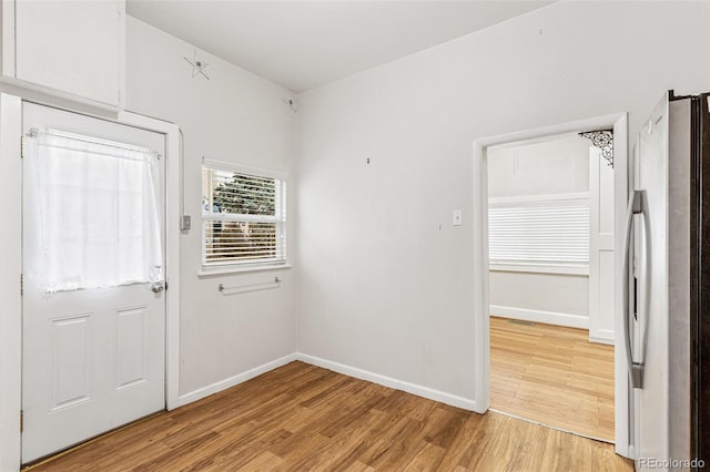 foyer with light hardwood / wood-style floors