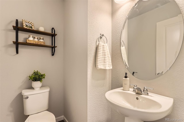 bathroom with toilet and sink