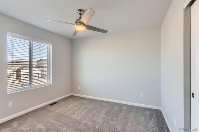 carpeted empty room with ceiling fan