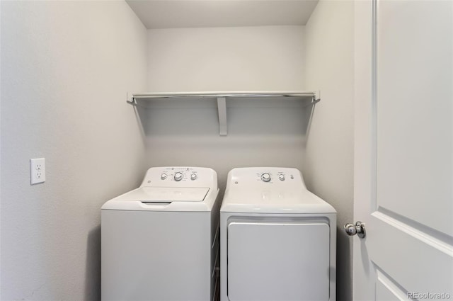 clothes washing area with washer and dryer