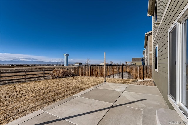 view of patio / terrace featuring a mountain view