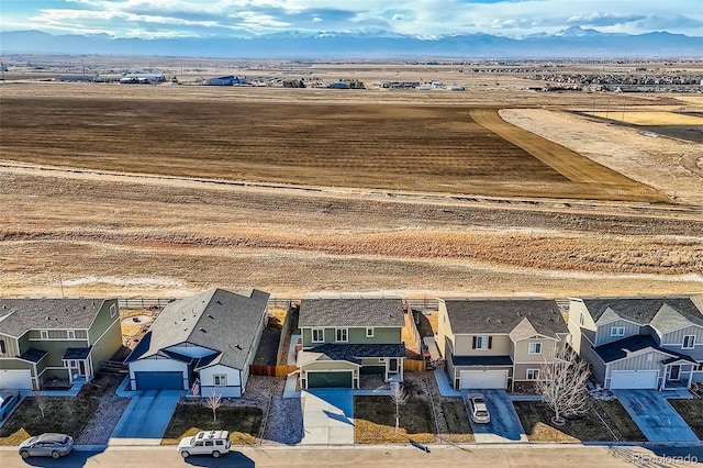 birds eye view of property with a mountain view