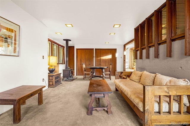 1455 La Mesa St, Colorado Springs, CO 80904 - living room featuring a wood stove and carpet flooring