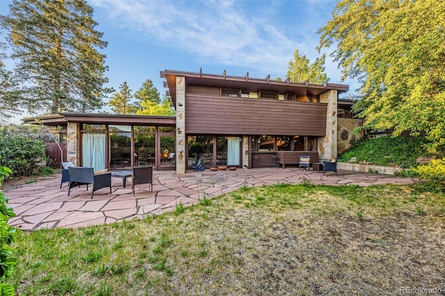 1455 La Mesa St, Colorado Springs, CO 80904 - back of house featuring a patio and stone siding