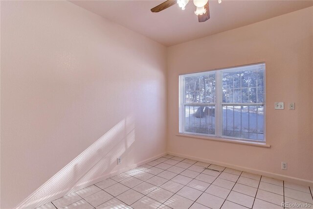 tiled spare room with ceiling fan