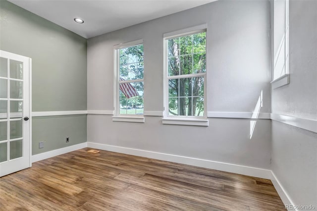 10609 Abilene St, Commerce City, CO 80022 - empty room with healthy amount of natural light and wood finished floors