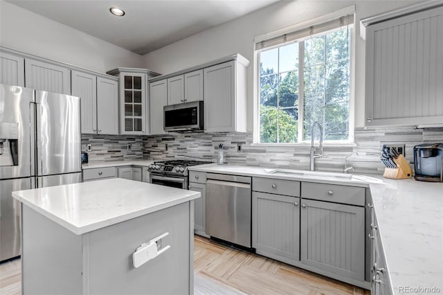 10609 Abilene St, Commerce City, CO 80022 - kitchen with stainless steel appliances, gray cabinets, healthy amount of natural light, and recessed lighting