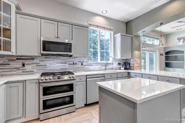 10609 Abilene St, Commerce City, CO 80022 - kitchen with stainless steel appliances, gray cabinetry, light countertops, and recessed lighting