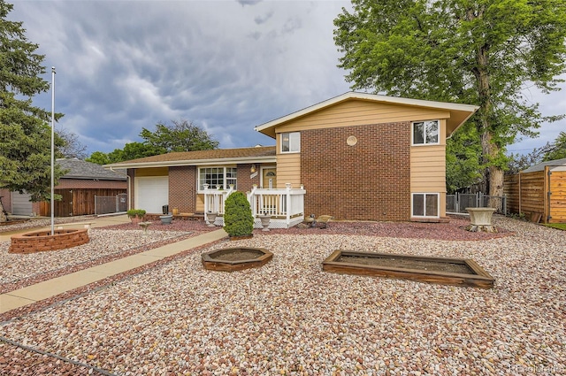6072 Pierson Ct, Arvada, CO 80004 - rear view of house featuring an attached garage and brick siding