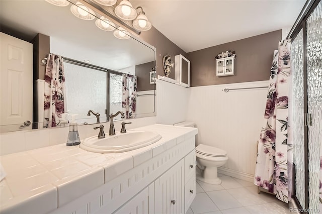 6072 Pierson Ct, Arvada, CO 80004 - full bath with vanity, tile patterned flooring, curtained shower, and wainscoting