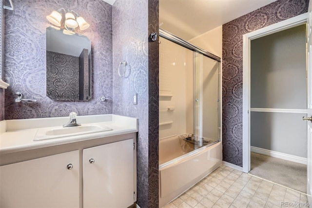 6072 Pierson Ct, Arvada, CO 80004 - bathroom with wallpapered walls, vanity, and combined bath / shower with glass door