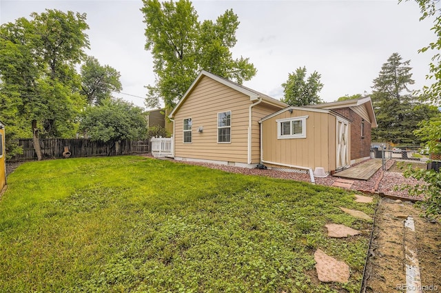 6072 Pierson Ct, Arvada, CO 80004 - rear view of house with a fenced backyard and board and batten siding