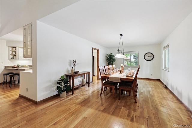3298 S Krameria St, Denver, CO 80222 - dining space with light wood-style floors and baseboards