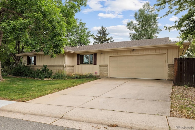 3298 S Krameria St, Denver, CO 80222 - ranch-style house featuring brick siding, an attached garage, driveway, and board and batten siding