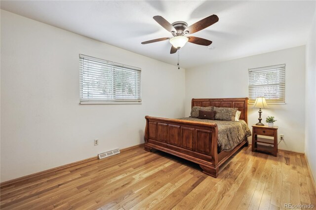 3298 S Krameria St, Denver, CO 80222 - bedroom featuring light wood-type flooring and a ceiling fan