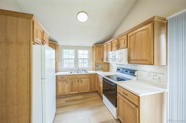 9642 W Chatfield Ave Unit A, Littleton, CO 80128 - kitchen with white appliances, a textured ceiling, light wood-type flooring, light countertops, and lofted ceiling