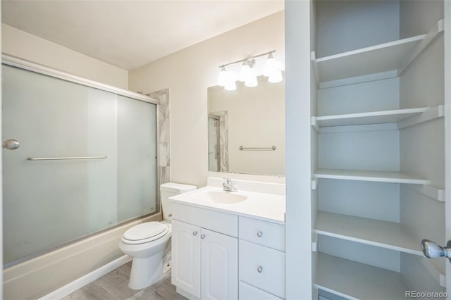 9642 W Chatfield Ave Unit A, Littleton, CO 80128 - full bathroom featuring bath / shower combo with glass door and vanity