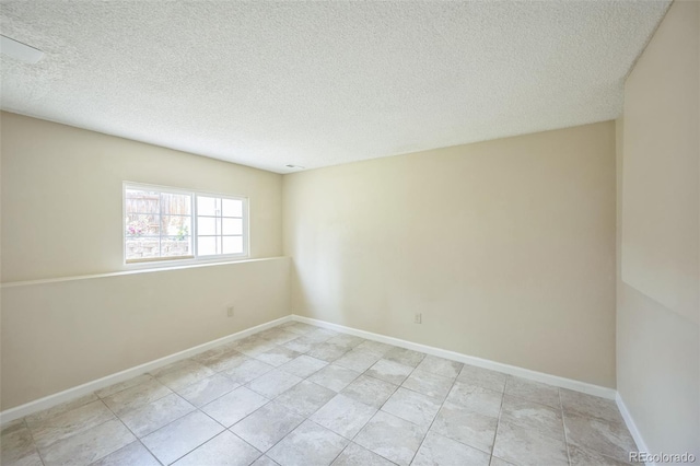 9642 W Chatfield Ave Unit A, Littleton, CO 80128 - empty room with a textured ceiling and baseboards