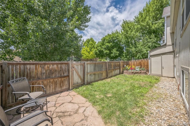 9642 W Chatfield Ave Unit A, Littleton, CO 80128 - fenced backyard featuring a patio