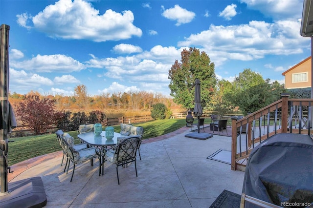 view of patio / terrace featuring fence, area for grilling, and outdoor dining area
