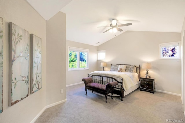 carpeted bedroom with vaulted ceiling, baseboards, and a ceiling fan