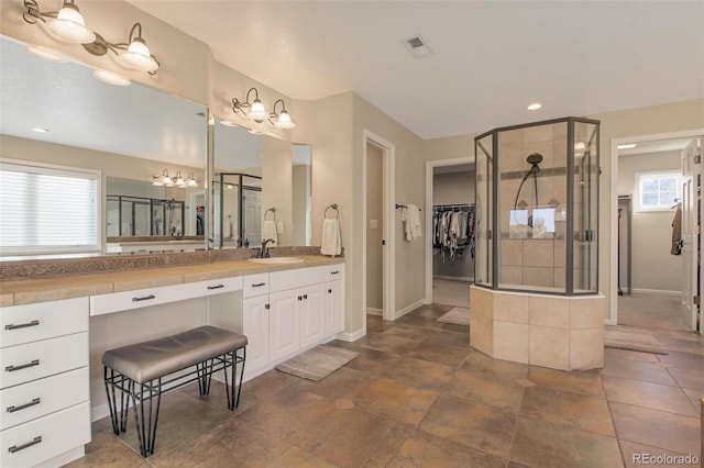 bathroom featuring a stall shower, a notable chandelier, baseboards, and visible vents