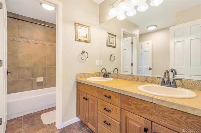 bathroom with a sink, double vanity, and shower / bathtub combination
