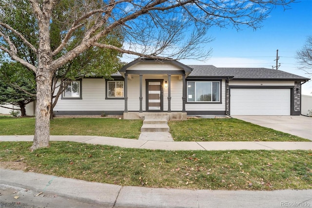 view of front of property featuring a front lawn and a garage