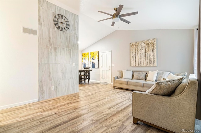 living room featuring hardwood / wood-style floors, ceiling fan, and lofted ceiling