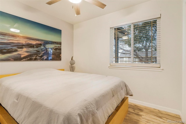 bedroom with light wood-type flooring and ceiling fan