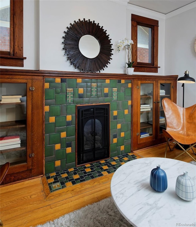 3237 N Josephine St, Denver, CO 80205 - living room featuring wood finished floors, crown molding, and a tiled fireplace