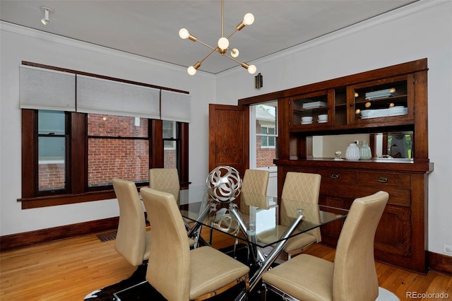 3237 N Josephine St, Denver, CO 80205 - dining room with a chandelier, ornamental molding, and light wood finished floors