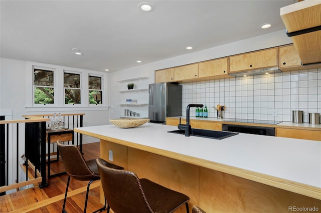 3237 N Josephine St, Denver, CO 80205 - kitchen featuring freestanding refrigerator, wall oven, light wood-style floors, tasteful backsplash, and light countertops