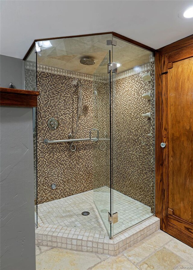 3237 N Josephine St, Denver, CO 80205 - full bath featuring a shower stall and stone finish flooring