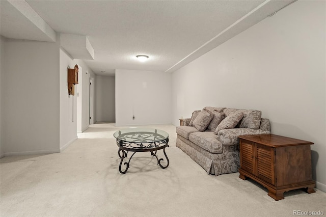 carpeted living room featuring baseboards