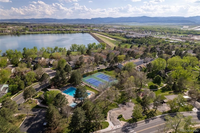 bird's eye view of a water and mountain view and a pool