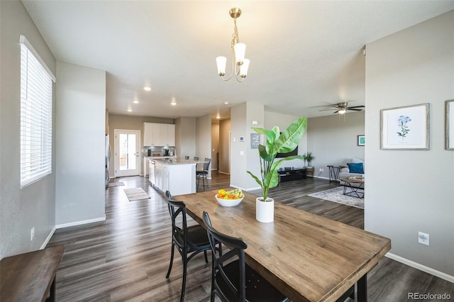 dining area with recessed lighting, baseboards, dark wood-style flooring, and ceiling fan with notable chandelier