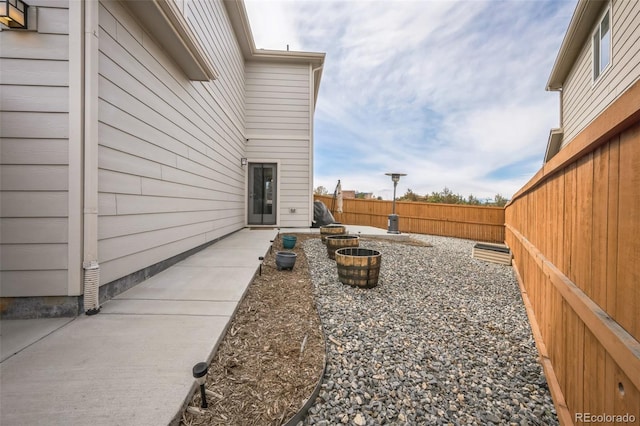view of yard with a fenced backyard and a patio area