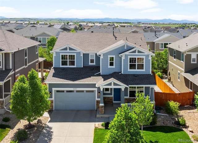 10057 Des Moines St, Parker, CO 80134 - craftsman-style house featuring a residential view, concrete driveway, roof with shingles, and an attached garage