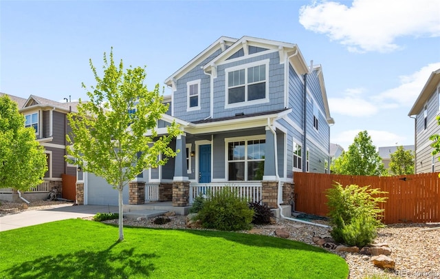10057 Des Moines St, Parker, CO 80134 - craftsman inspired home featuring stone siding, covered porch, driveway, and an attached garage