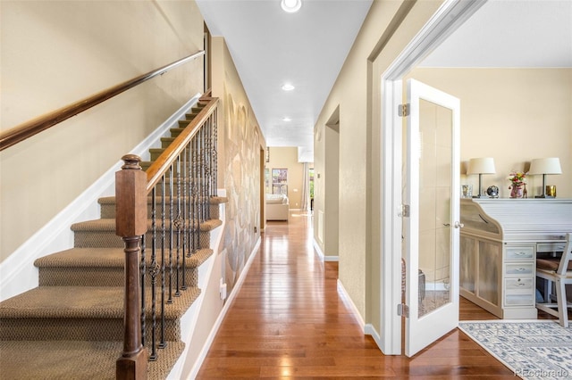 10057 Des Moines St, Parker, CO 80134 - corridor featuring hardwood / wood-style floors, stairway, recessed lighting, french doors, and baseboards