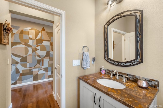 10057 Des Moines St, Parker, CO 80134 - bathroom featuring hardwood / wood-style flooring and vanity