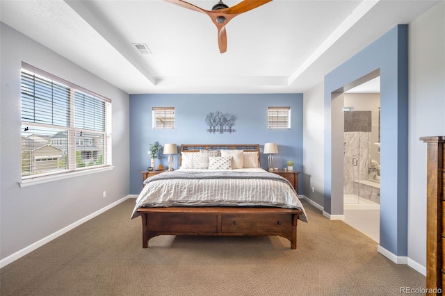 10057 Des Moines St, Parker, CO 80134 - bedroom featuring a raised ceiling, carpet, and multiple windows