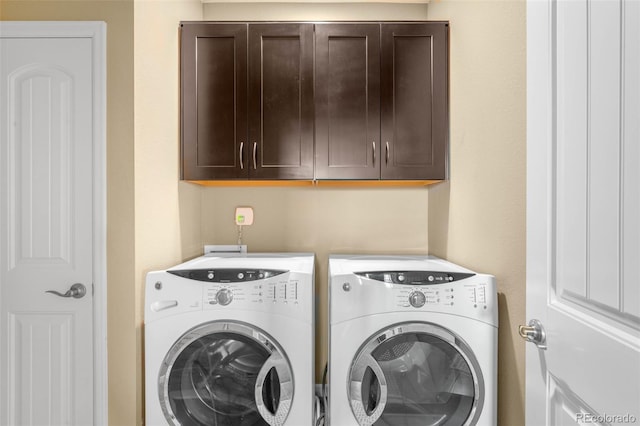 10057 Des Moines St, Parker, CO 80134 - laundry room with washing machine and dryer and cabinet space