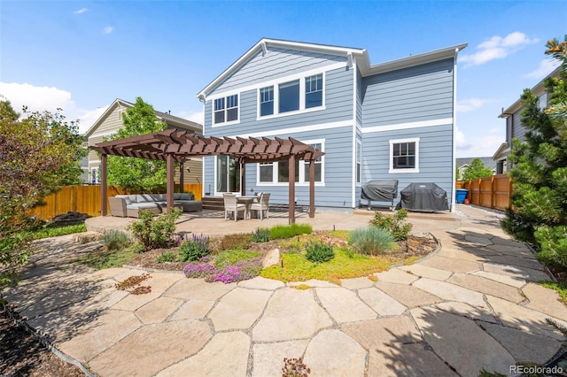 10057 Des Moines St, Parker, CO 80134 - back of property featuring a pergola, an outdoor hangout area, a patio, and a fenced backyard