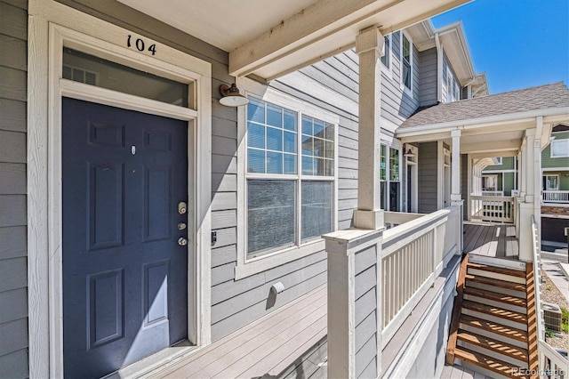 doorway to property featuring covered porch