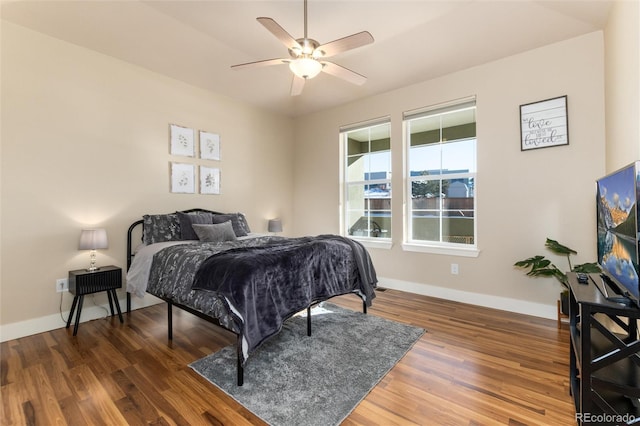 bedroom featuring dark wood-type flooring and ceiling fan