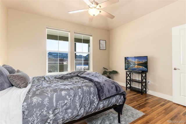 bedroom featuring ceiling fan and dark hardwood / wood-style flooring