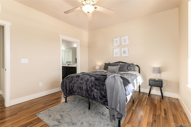 bedroom with ceiling fan, connected bathroom, and dark hardwood / wood-style floors