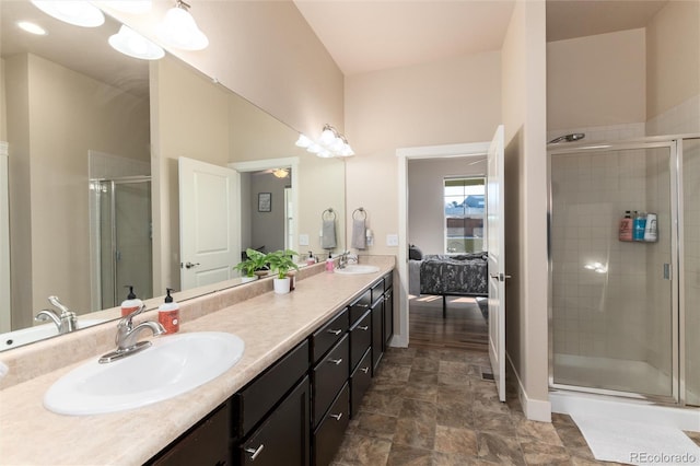 bathroom featuring an enclosed shower and vanity